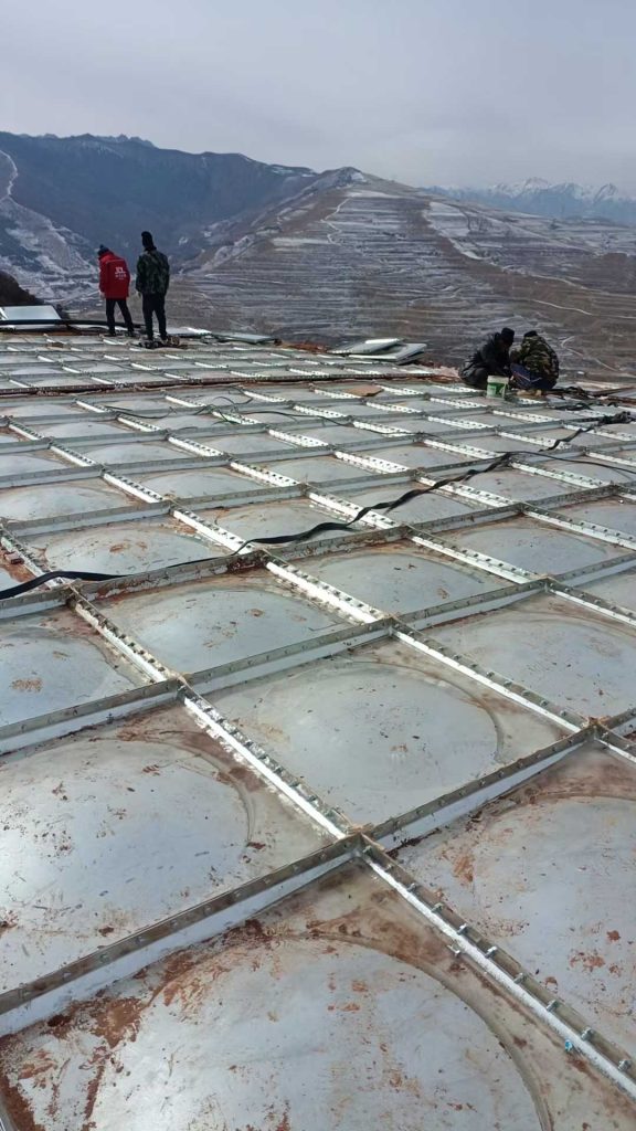 Modular bolted water tank installation in remote high-altitude area with difficult transportation and construction conditions.