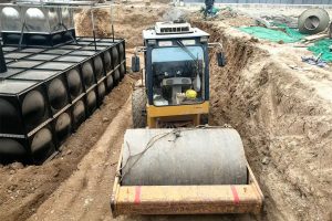 Composite buried steel water tank structure with anti-corrosion system