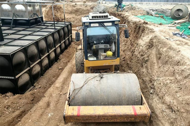 Composite buried steel water tank structure with anti-corrosion system